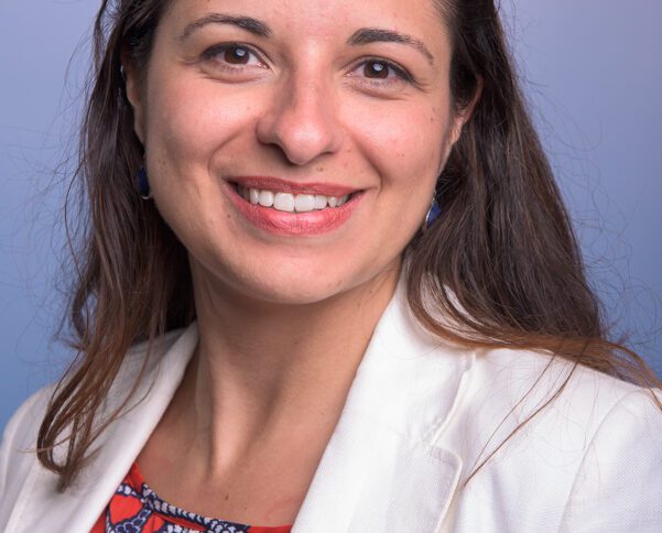 Young female professor in lab coat