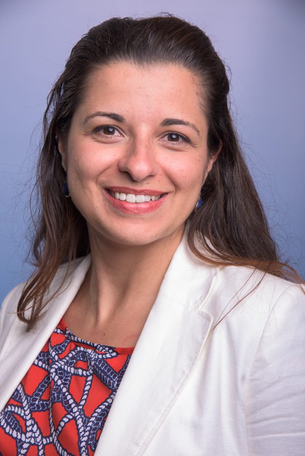 Young female professor in lab coat