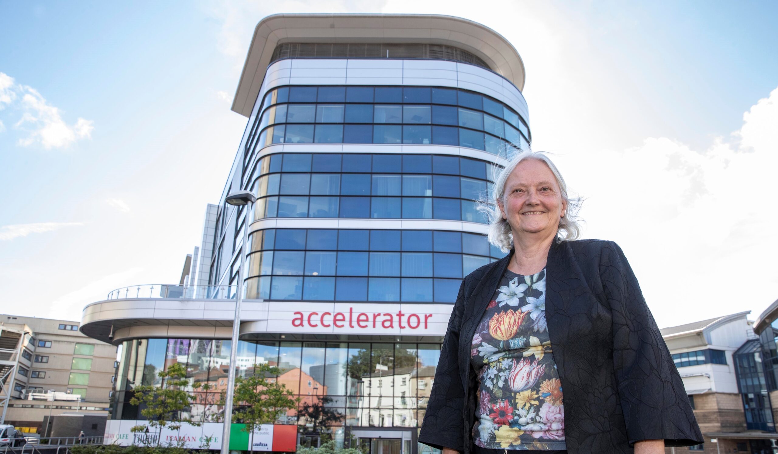 Professor Janet Hemingway standing in front of the Accelerator Building