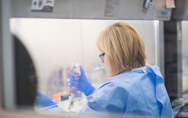 Female scientist working in high-security laboratory