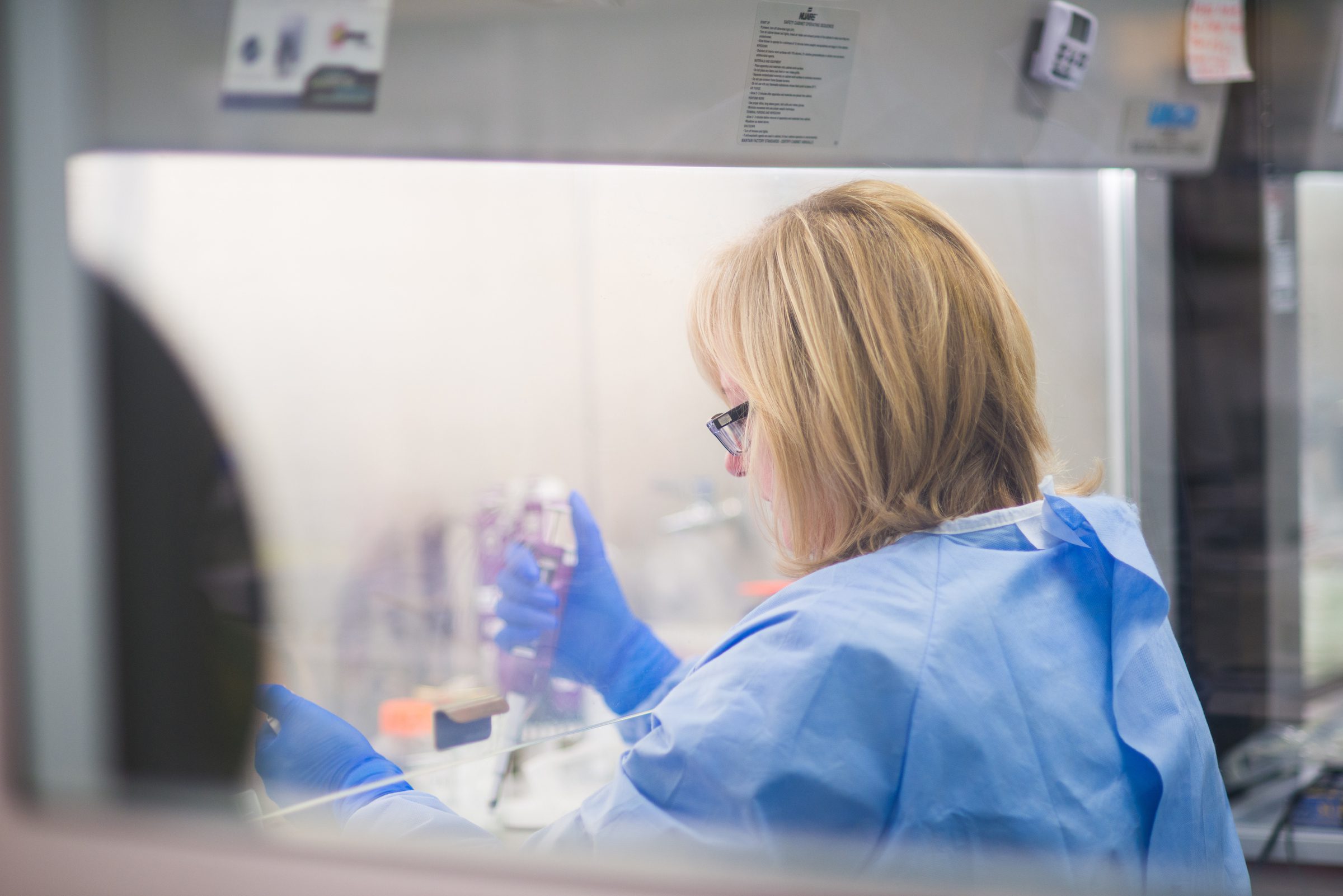 Female scientist working in high-security laboratory