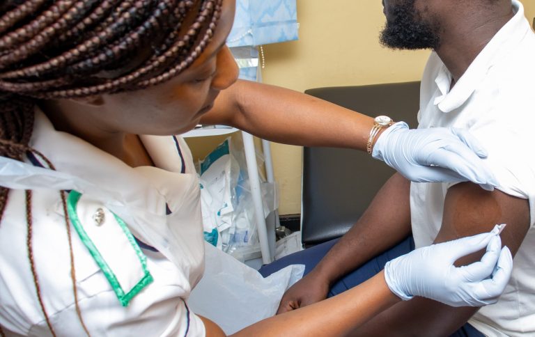 Nurse with a clinical trial participant