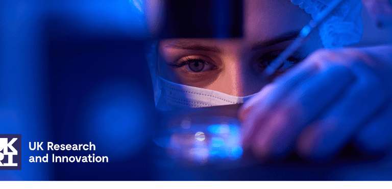 Experienced female scientist preparing specimens for microscopic examination