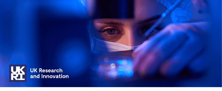 Experienced female scientist preparing specimens for microscopic examination